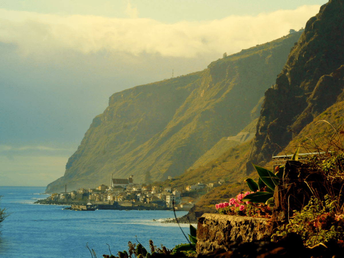 a view of a large body of water with a mountain in the background