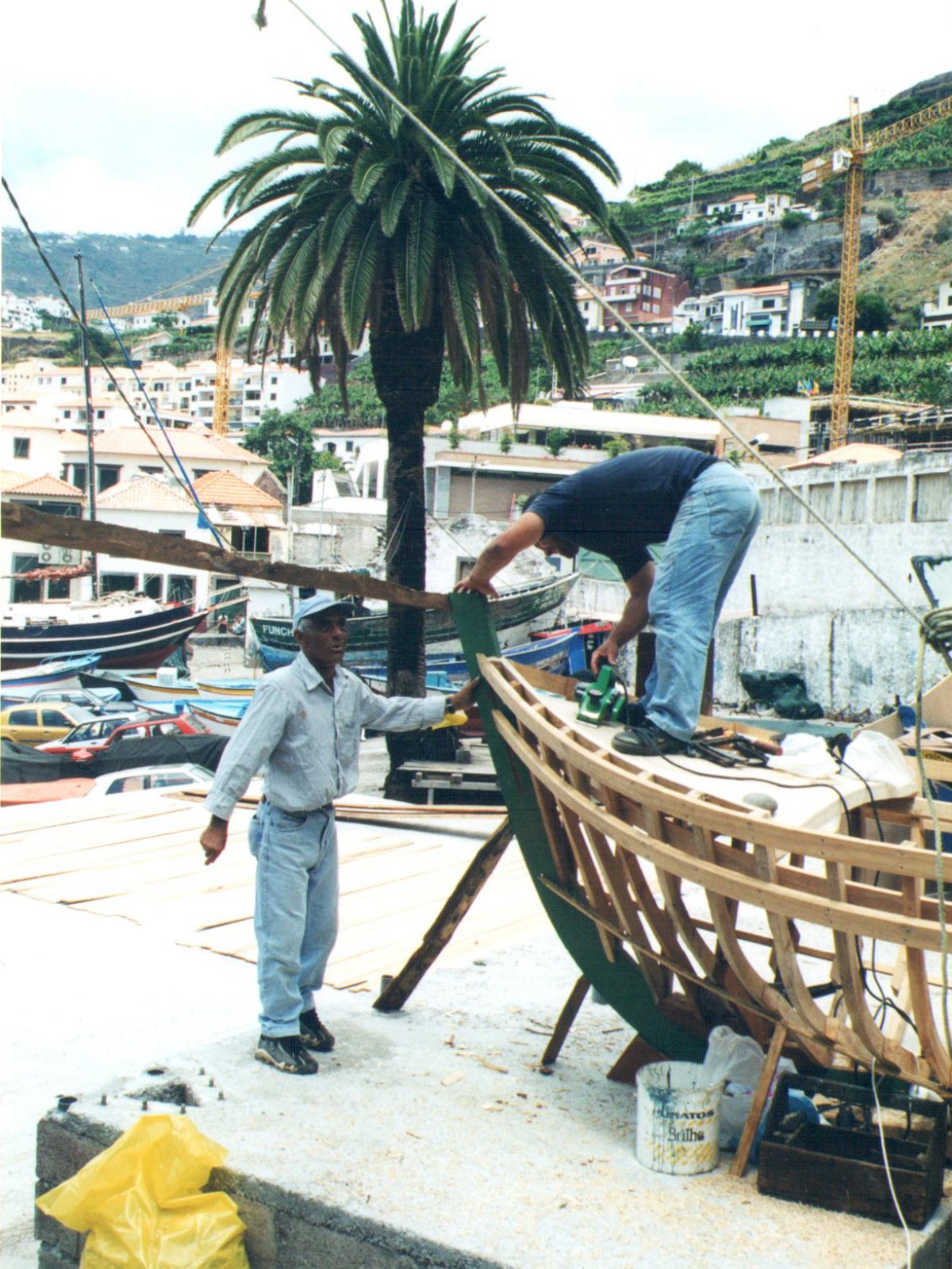 a group of people sitting at a dock