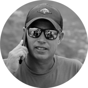 a man wearing sunglasses posing for the camera